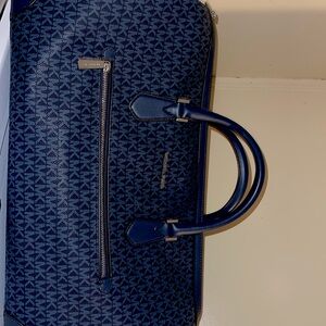 Micheal kors duffle and back pack. Worn once.